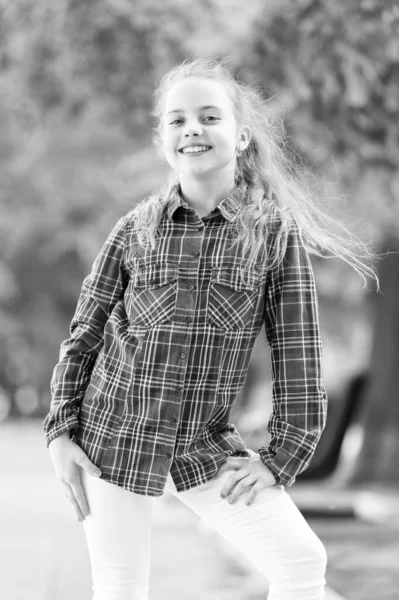 Girl little cute child enjoy walk on windy day nature background. Feeling cozy and comfortable on windy day. Deal with long hair on windy day. Hairstyles to wear on windy days. Windproof hairstyles — Stock Photo, Image