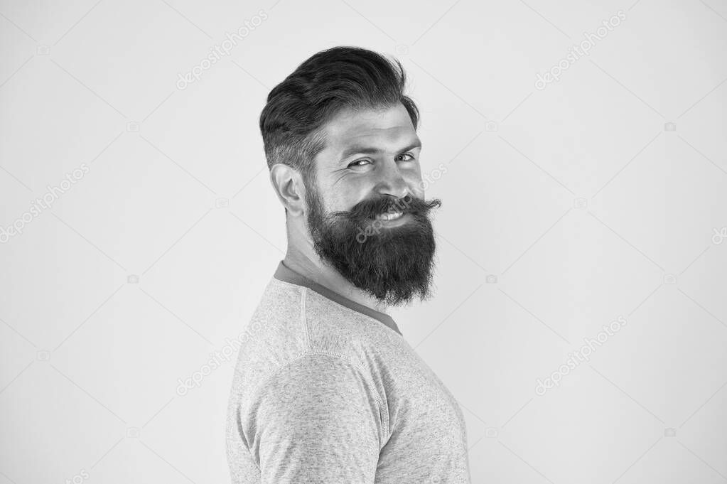 Bring your hair to the next level. Happy hipster with long beard and stylish hair on yellow background. Bearded man with unshaven face hair. Brutal guy with shaped beard and mustache hair