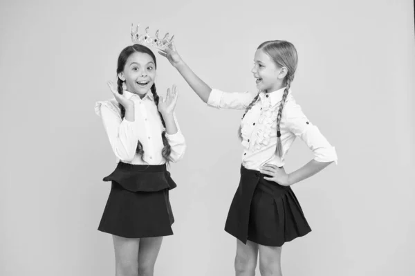 Big boss. motivation to study. Friendship. prom queen. childhood pride. education success. back to school. selfish small girls dream about future. happy girls in uniform and crown. thank you — Stock Photo, Image