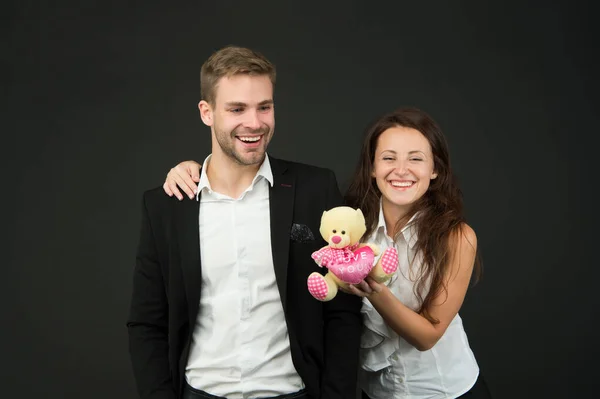 Everyday with you is like Valentines Day. Happy valentines couple dark background. Couple in love with valentines teddy bear. Love comes from heart. Valentines day is finally here