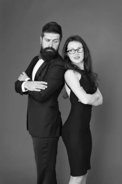 formal couple. power of teamwork. Collaboration is a key to success. formal couple of businesspeople. business meeting in formal wear. couple in love. man in tuxedo with woman in elegant dress