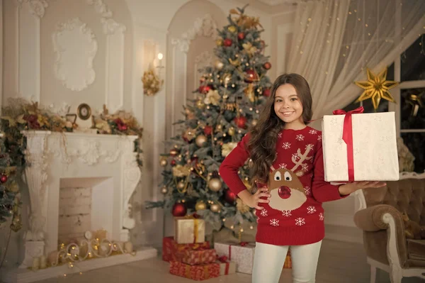 Little child girl likes xmas present. The morning before Xmas. New year holiday. Christmas. Kid enjoy the holiday. Happy new year. small happy girl at christmas. Thank you. santa claus — Stock Photo, Image