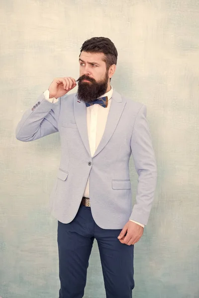 Suit style. Fashion trends for groom. Wedding day. Stylish groom. Statement with his stunning crisp suit jacket. Stylist fashion expert. Groom bearded hipster man wear light blue tuxedo and bow tie