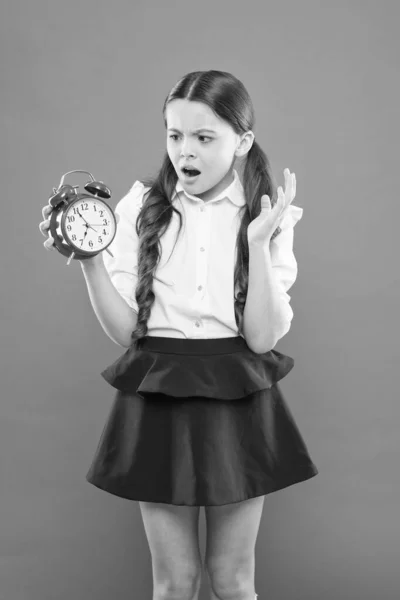 Classes begin. Developing discipline. Time for break and relax. Vacation time. Elementary school day bell schedule. Schooltime concept. Avoid being late. Schoolgirl hold alarm clock. Time to study — Stock Photo, Image