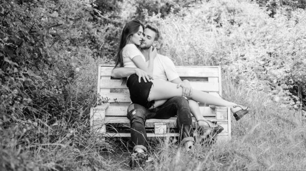 Lovers cuddling. Couple in love sit bench. Summer vacation. Romantic date in park. Handsome man pretty girl in love. Trust and intimacy. Sensual hug. Love and romance concept. Relaxing with darling — Stock Photo, Image