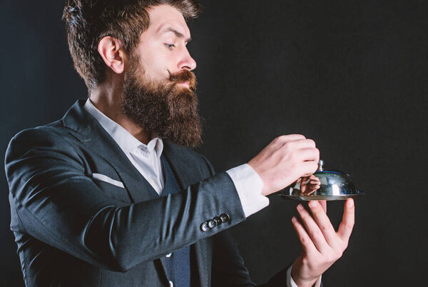 Healthy food for success. brutal caucasian hipster hold metallic dish. Waiter man. Perfect recipe. businessman in suit. Mature with beard hold food tray in restaurant. Bearded man chef present meal