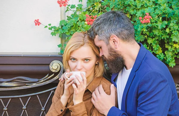 Couple in love on romantic date. Morning coffee. First meet of girl and mature man. Brutal bearded hipster and girl drink coffee. woman and man with beard relax in cafe. Morning inspiration