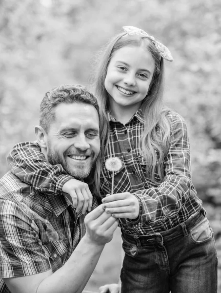 family summer farm. spring village country. ecology. Happy family day. little girl and happy man dad. earth day. daughter and father with dandelion flower. Professional gardener