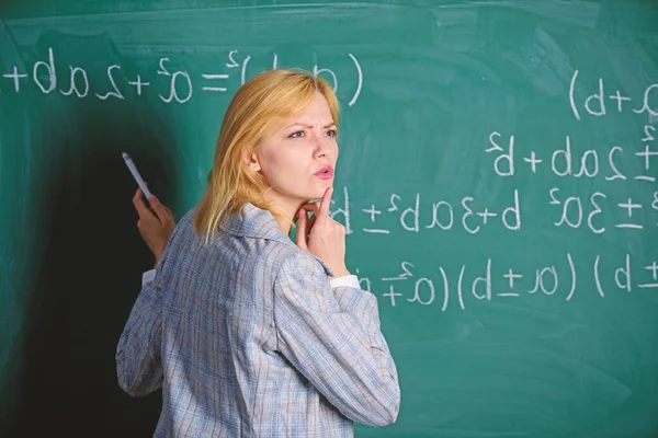 Lost in thoughts. Study and education. Modern school. Knowledge day. woman in classroom. Back to school. Teachers day. teacher on school lesson at blackboard. School. Home schooling. thoughtful woman Stock Image