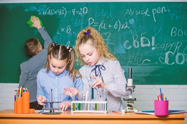 Students doing biology experiments with microscope. Little kids learning chemistry in school lab. Chemistry. Back to school. Little children at school lesson. happy childrens day. I can cure you — Stock Photo, Image