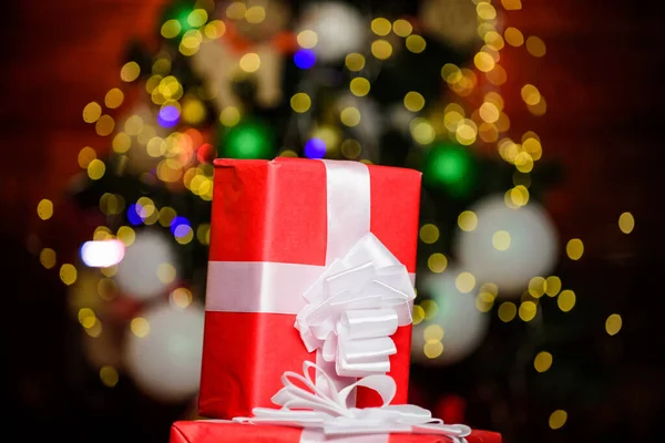 Wrapping gifts concept. Magic moments. Prepare surprise gifts for family. Gift from Santa. Composition with gift boxes ribbon bow. Red wrapped gifts or presents. Prepare for christmas and new year