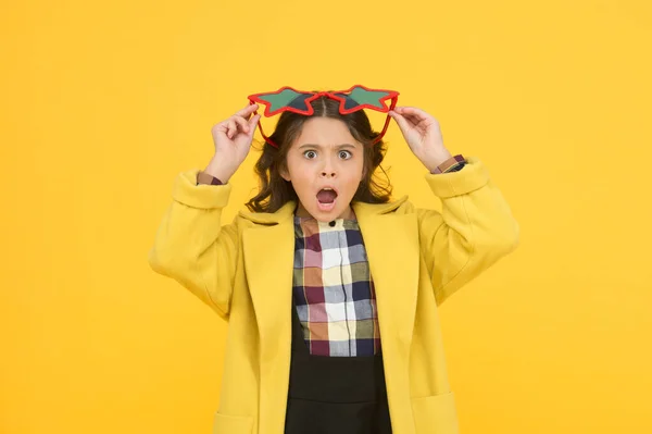 Im surprised. Small schoolgirl keep mouth open with surprise. Little girl look surprised yellow background. Surprised child in fashion school style. Being surprised. Surprise school party celebration