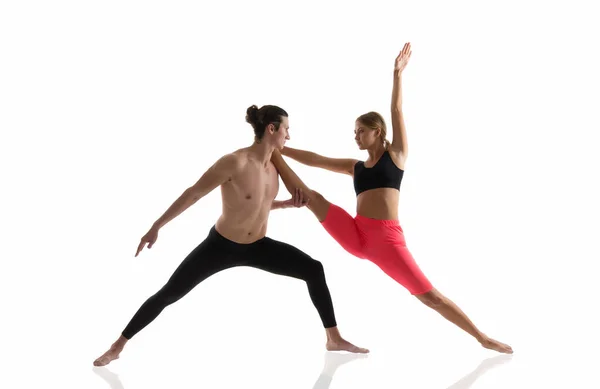 Overall fitness. Couple of athletes isolated on white. Athletic man and woman perform pilates workout. Full body athletic class. Sexy sportsman and sportswoman. Athletic training. Athletic and strong — Stock Photo, Image