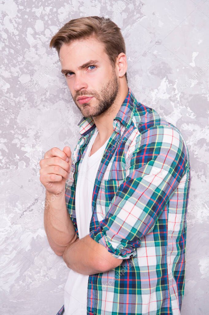 thoughtful guy checkered shirt. good looking unshaven man. concept. mens sensuality. bristle barber shop. sexy guy casual style. macho man grunge background. male fashion model. Stylish and sexy