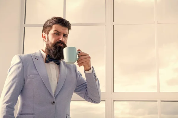 future opportunities. serious bearded man drink coffee. businessman in formal outfit. modern life. confident business man at window. future success. morning inspiration. copy space. Future is now