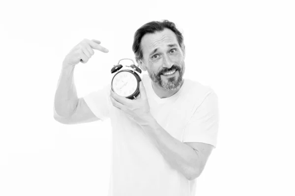Ringing alarm clock. Personal schedule and daily regime. Alarm clock morning time. Man bearded mature guy hold clock isolated on white. Man with beard check what time is it. Time management skills — Stock Photo, Image