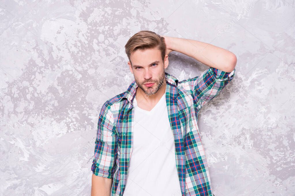 being a man. male fashion summer trends. confident student checkered shirt. unshaven man care skin and beard. barbershop concept. mens sensuality. sexy guy casual style. macho man grunge background