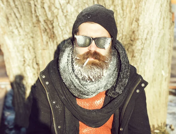 Handsome bearded man smokes cigarette — Stock Photo, Image