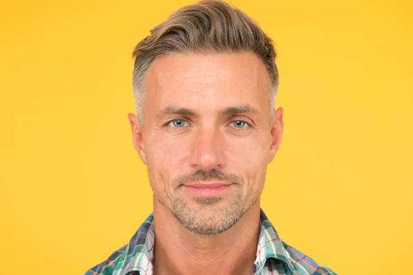 Male natural beauty. sexy man yellow background. portrait of real man. mature man unshaven face. smiling guy pleasant face. male skin and facial care. confident fashion model. barber salon services — Stock Photo, Image