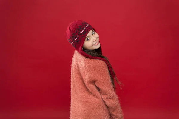 Change your look this winter. Happy child with beauty look red background. Vogue look of small fashion model. Little girl wear warm hat with winter look. Fashion and beauty — Stock Photo, Image