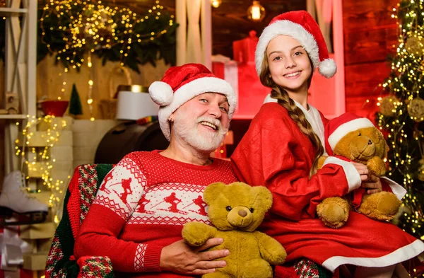 Family time. Family tradition concept. Christmas eve. Boxing day. Happy childhood. Child enjoy christmas with Santa claus. Granddaughter spend time with grandpa. Visiting grandparents. Family home