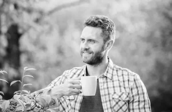 morning coffee. healthy lifestyle. nature and health. drink tea outdoor. ecological life for man. man in green forest. breakfast refreshment time. happy man with cup of tea. Good morning coffee