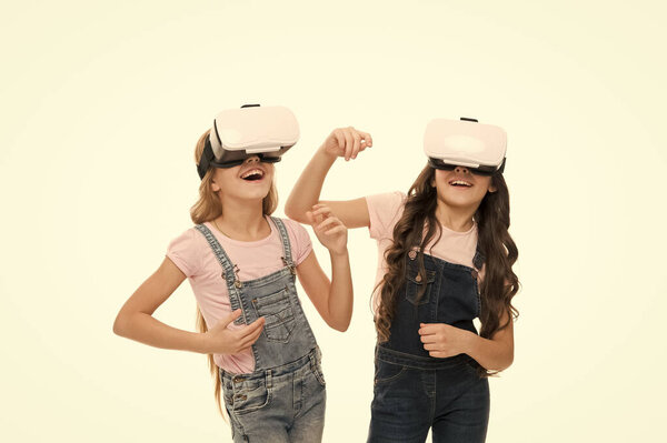 VR tours for students. Little children wearing VR headsets. Small girls using VR glasses. Adorable kids enjoying VR experience