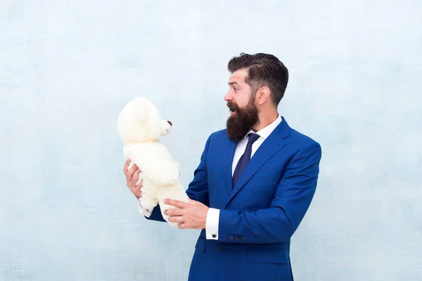 Surprise will melt her heart. Romantic teddy bear surprise. Giving is pleasure. Valentines day surprise. Play with toy. Romantic gift. Man wear tuxedo tie hold soft toy. International womens day — Stock Photo, Image