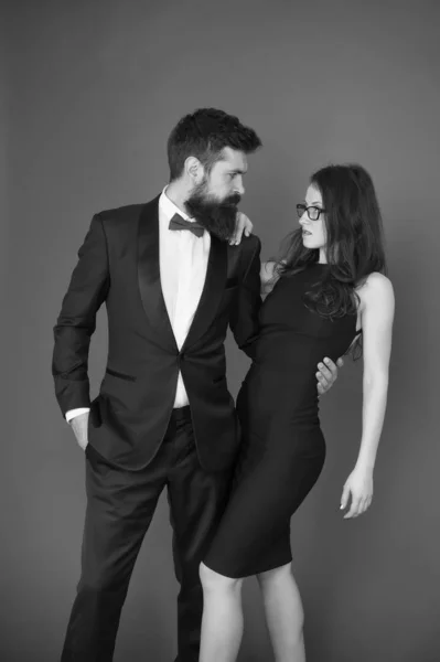 Formal party. Couple in love on date. art experts of bearded man and woman. esthete. Romantic relationship. Formal sexy couple. formal fashion for couple. romantic couple in formal tuxedo and dress