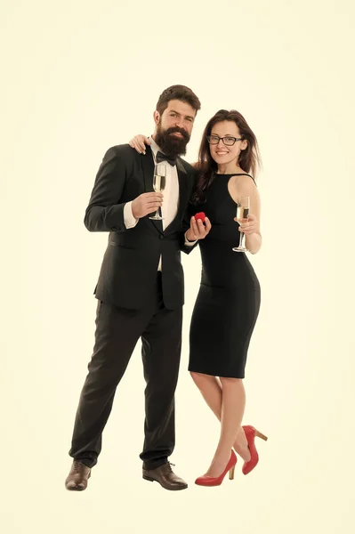 Marry me. Their special day. Happy holiday celebration. Wedding and proposal concept. Handsome man and elegant woman hold champagne glasses. Anniversary and family holiday. Family celebrate holiday