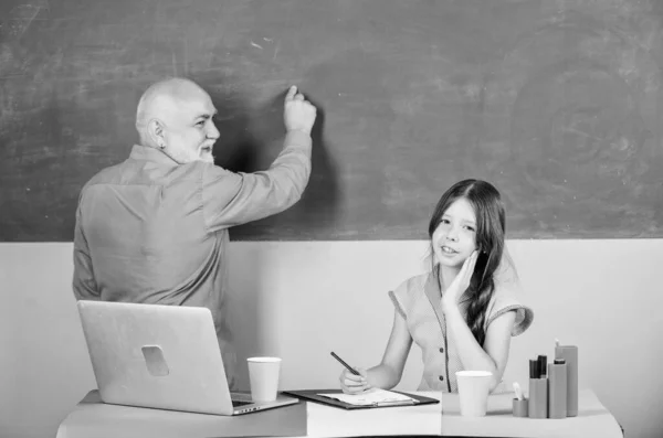 Study hard. Student and teacher man at blackboard. Schoolgirl and tutor laptop. Modern knowledge. Modern teaching method. Modern education. Tired student. Senior teacher and girl school lesson — Stock Photo, Image