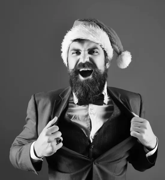 Hombre con barba en traje inteligente y sombrero de Santa. —  Fotos de Stock