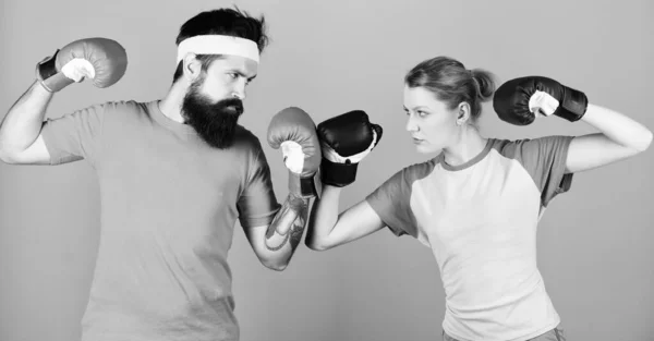 punching, sport Success. training with coach. knockout and energy. couple training in boxing gloves. sportswear. Fight. Happy woman and bearded man workout in gym. boxing couple. boxing workout.