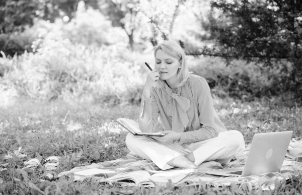 Guide starting freelance career. Become successful freelancer. Woman with laptop sit on rug grass meadow. Girl with notepad write note. Business lady freelance work outdoors. Freelance career concept — Stock Photo, Image