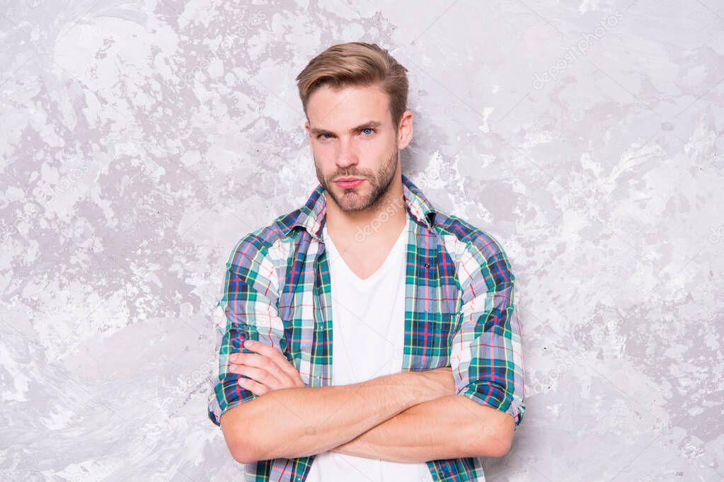 man among men. barbershop concept. mens sensuality. sexy guy casual style. macho man grunge background. male fashion summer trends. confident student checkered shirt. unshaven man care skin and beard