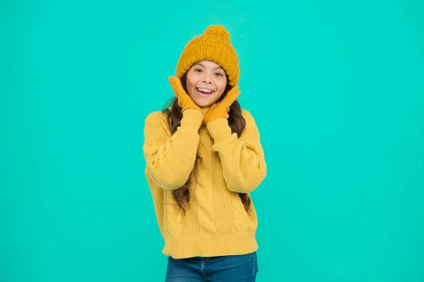Ski resort. get ready for winter holiday. homemade knit. cold season fashion. keep yourself warm. small girl in favorite sweater. hat and gloves accessory. happy child turquoise background. no flu — Stock Photo, Image