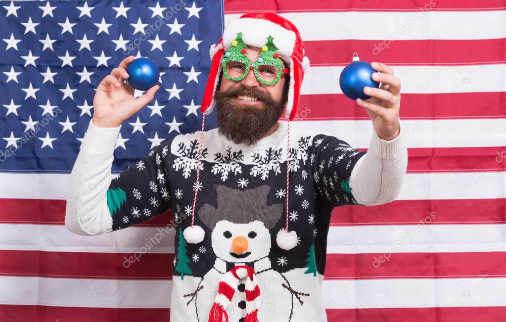 Being american can be fun. Bearded man have new year fun. Patriotic Santa on star spangled banner. Festive decor. Christmas Eve fun. Happy holidays. Holiday cheers. Seasons greetings. The fun begins