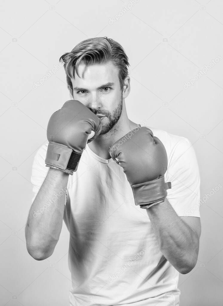 Motivated for victory. Sportsman boxer with gloves. Boxing concept. Man athlete boxer concentrated face. Boxer practice fighting skills. Boxer handsome strict coach. Strong muscles equal weapon