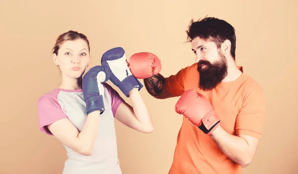 Amateur boxing club. Equal possibilities. Strength and power. Man and woman in boxing gloves. Be careful. Boxing sport concept. Couple girl and hipster practicing boxing. Sport for everyone