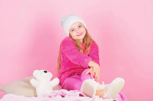 Child small girl playful hold teddy bear plush toy. Unique attachments to stuffed animals. Kid cute girl play with soft toy teddy bear pink background. Teddy bears improve psychological wellbeing