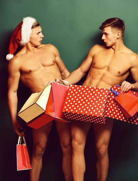 Knappe macho santa tweeling — Stockfoto