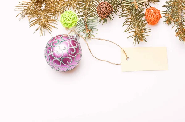 Everything you need to decorate christmas tree. Decorative ball toy and gift tag copy space. Get ready for christmas. Christmas decorations white background top view. Christmas decorations concept