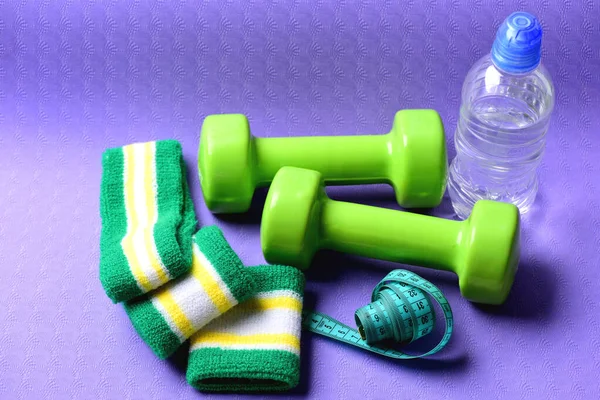 Dumbbells, water bottle, hand bands and measure tape