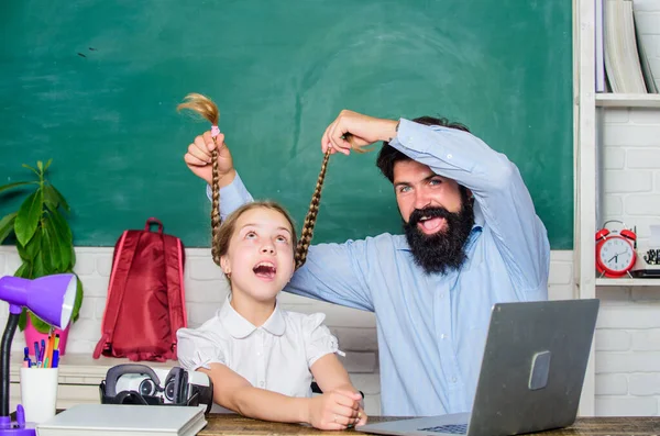 Homeschooling with father. Find buddy to help you study. Private lesson. Study online. School teacher and schoolgirl with laptop. Study modern technologies. Man bearded pedagogue teaching informatics