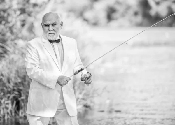 Hobby and recreation. Fishermen in formal suit. successful catch. business success. mature man fishing. fisher celebrate retirement. good production. retired businessman. Good profit. formal fashion — Stock Photo, Image