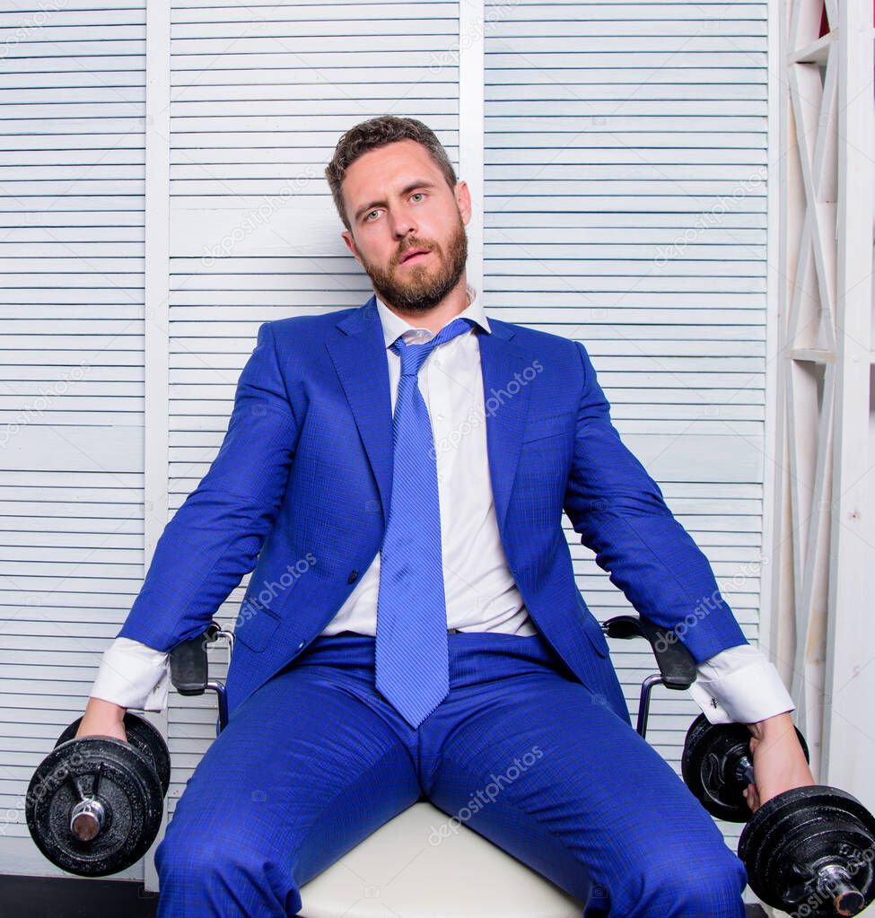 tired man working hard. should work for success. challenging himself. businessman hold dumbbell. sport and business. being best. overworker boss. time to relax. Strong powerful business strategy