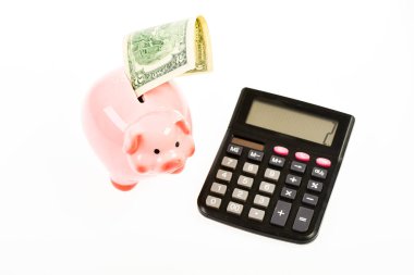 Ekonomi ve kâr yönetimi. Ekonomi ve finans. Yatırımın kazancı. Ekonomi ve işletme yönetimi. Piggy Bankası 'nın birikimleri. Domuz kumbarası ve hesap makinesi. Kredi borcu kavramı
