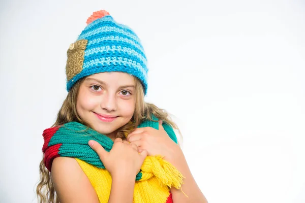 Which fabrics will keep you warmest this winter. Warm woolen accessories. Girl long hair happy face white background. Hat and scarf keep warm. Kid wear warm soft knitted blue hat and long scarf — 스톡 사진
