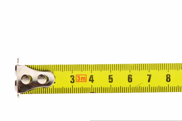 End of tape measure in yellow color with black numbers — Stock Photo, Image