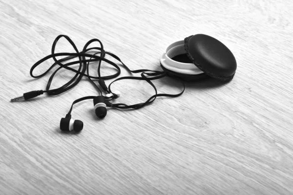 Equipment and music concept. Stereo headset and biscuit looking box. — Stock Photo, Image